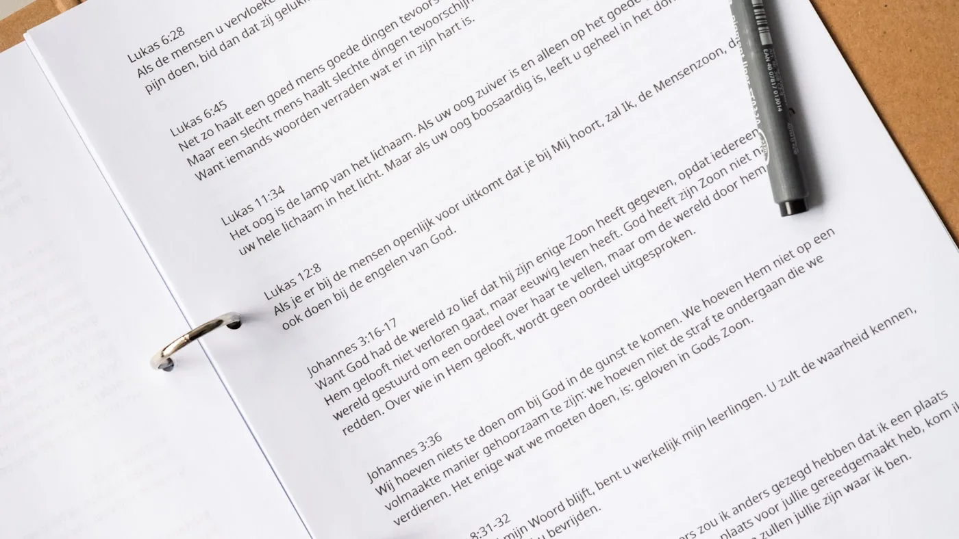 Printed documentation pages spread out with a pen resting on them